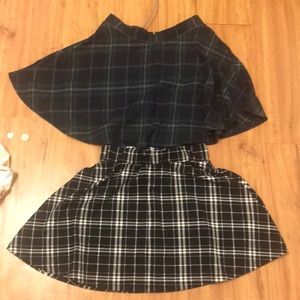 2 green and black skirts